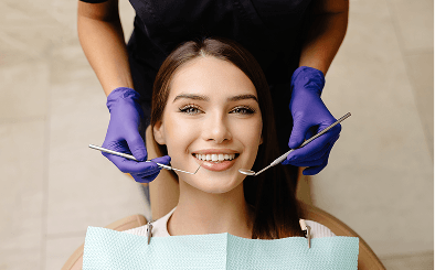 Dentist examining patient's teeth