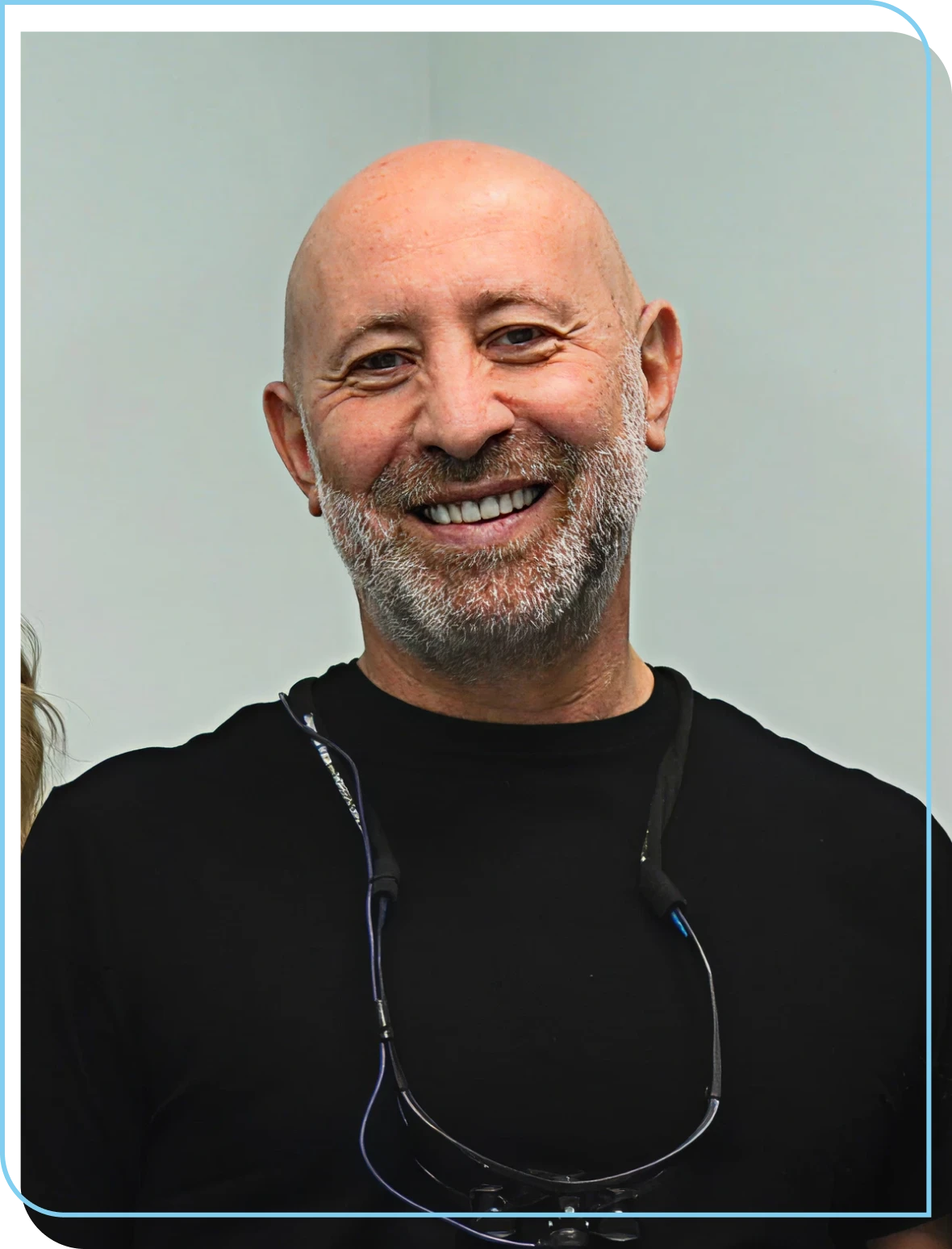 Bald man with a beard smiling