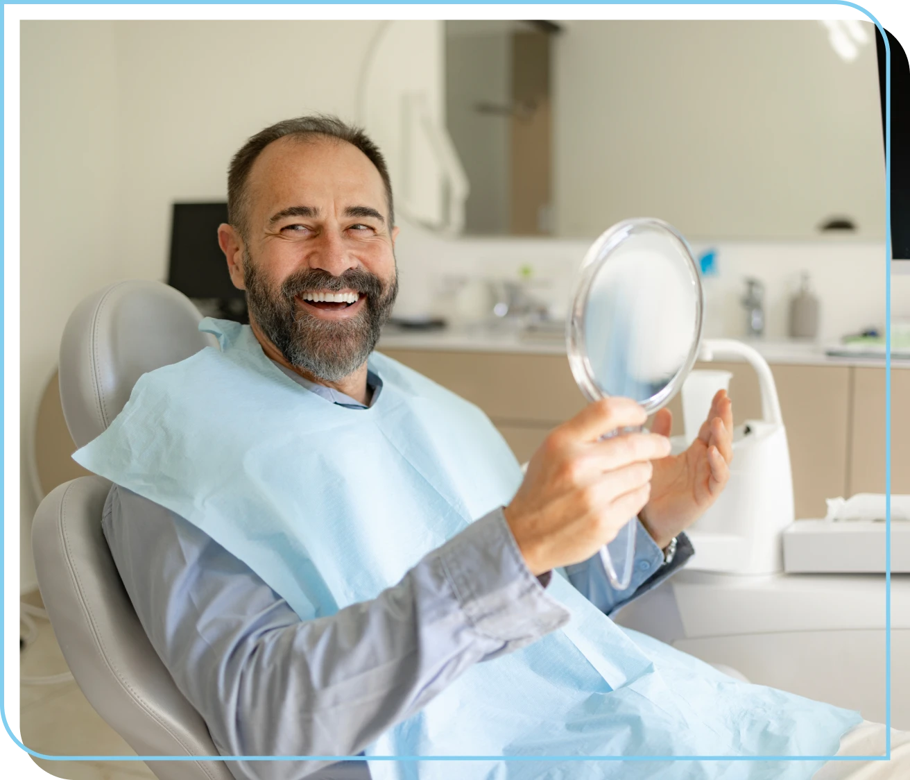 Man smiling with dental mirror