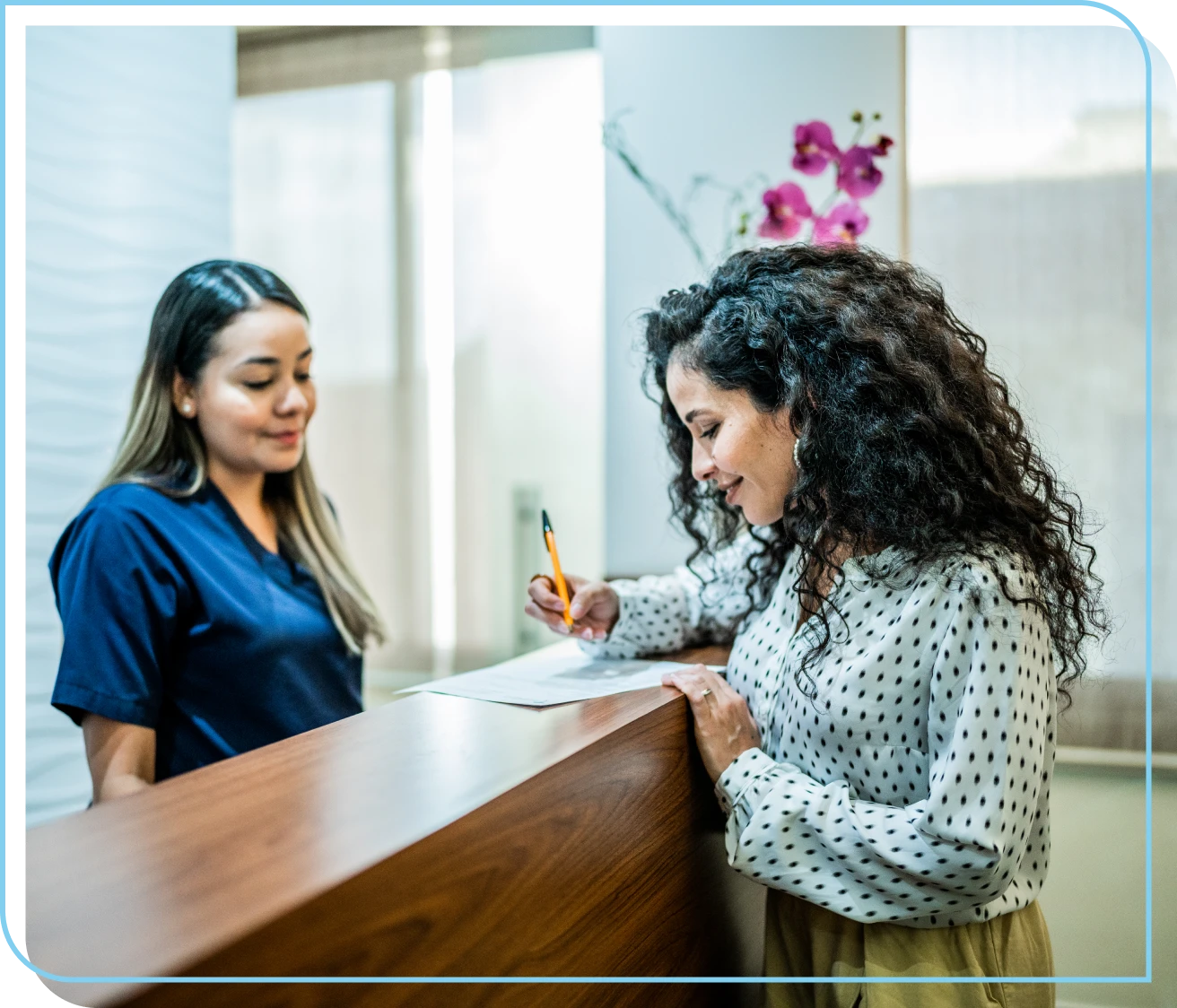 Woman filling out form at counter